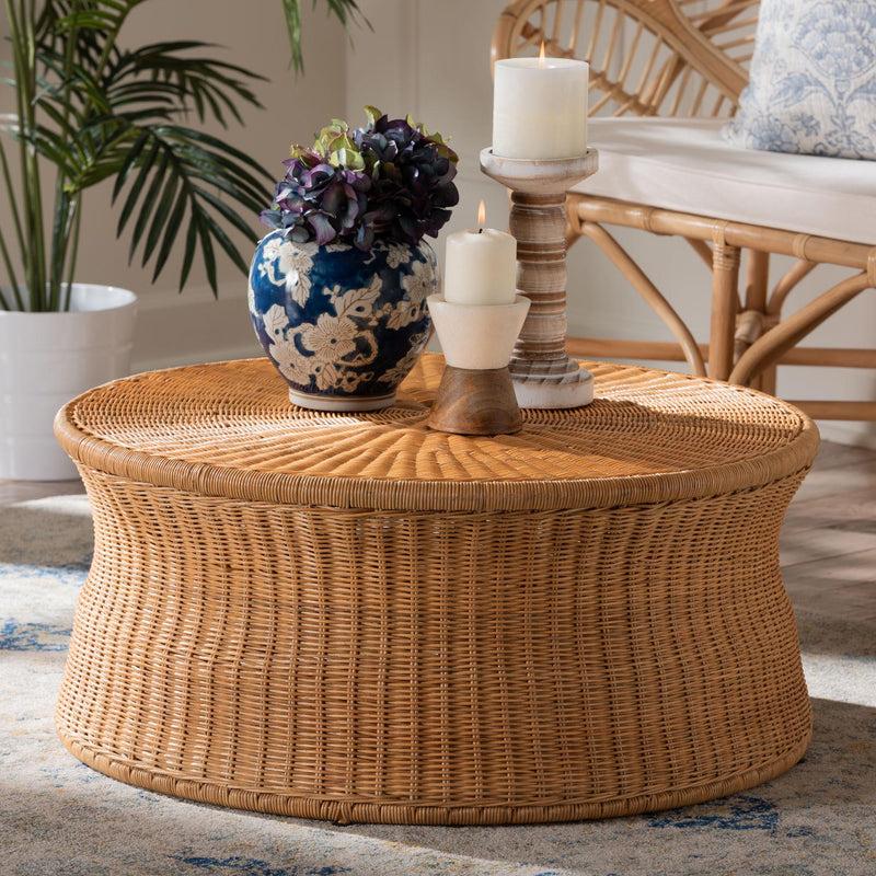 Drum Coffee Tables with candles and flower vase.