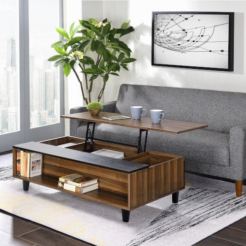 Modern lift-top coffee table with a walnut finish and black accents, featuring hidden storage and open shelving, displayed in a bright living room with a gray sofa, abstract wall art, large window, and indoor plant.