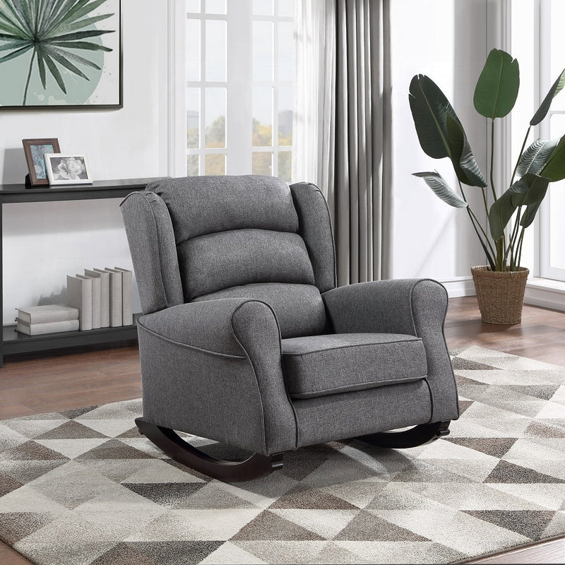 A gray fabric rocking chair in a modern apartment.