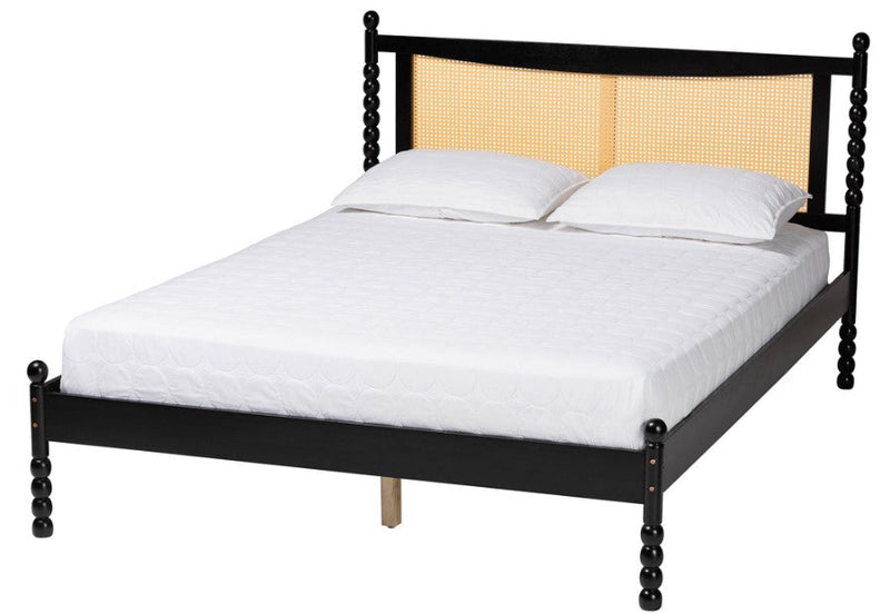 Modern bed with a black frame and woven headboard, styled with crisp white bedding