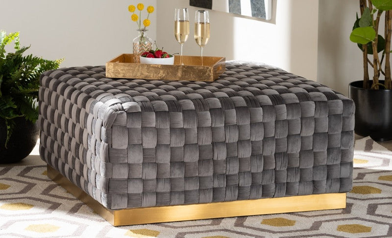 Gray woven velvet ottoman with gold base in modern living room decor
