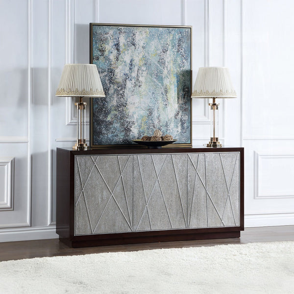 Modern sideboard with textured geometric front panels, decorated with two elegant table lamps and an abstract framed artwork in a stylish living room