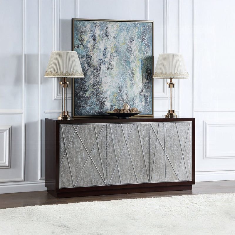 Modern sideboard with textured geometric front panels, decorated with two elegant table lamps and an abstract framed artwork in a stylish living room