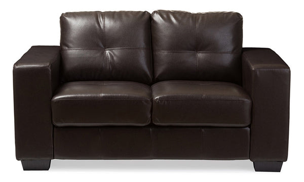 Modern dark brown leather sofa with wide arms and cushioned backrest