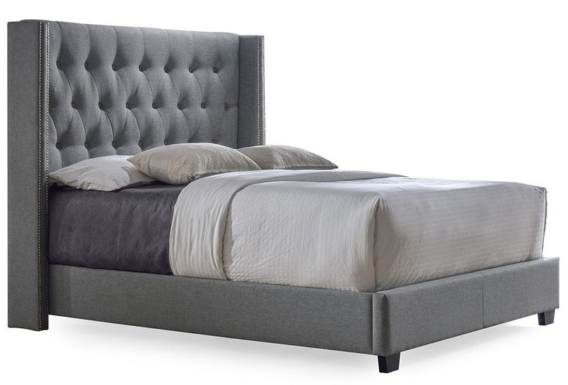 Tufted wingback headboard showcasing modern bedroom style trend for 2025