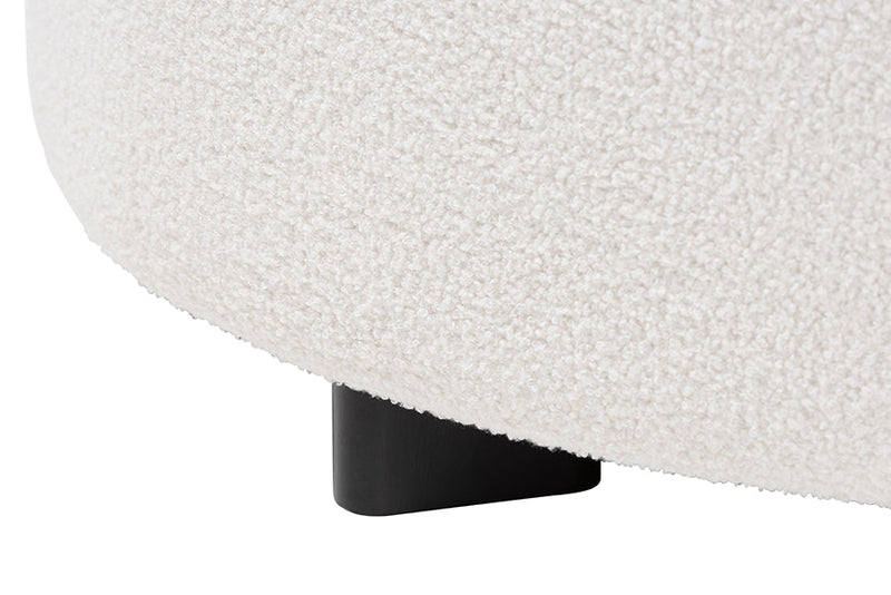 Paiva Ivory Boucle Upholstered and Black Round Ottoman Baxton