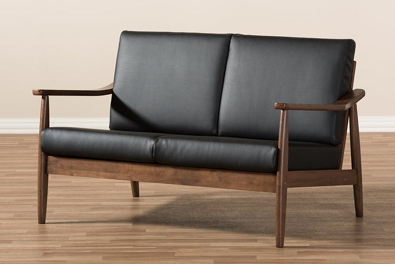 Carrie Walnut Wood Black Faux Leather 2-Seater Loveseat Baxton