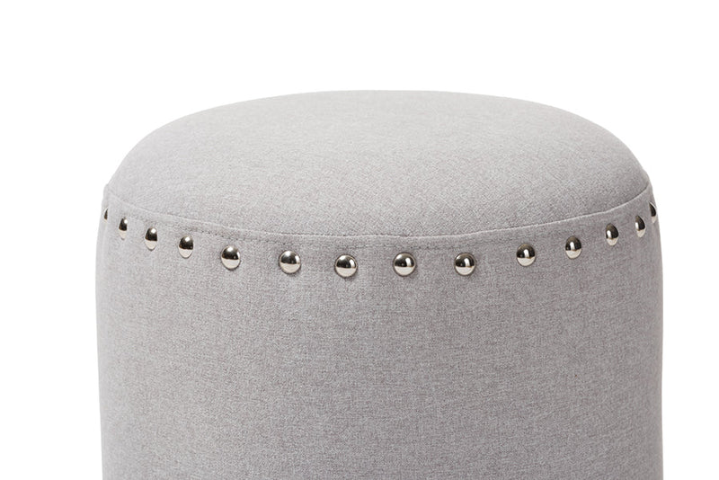 Augusta Light Gray Fabric Upholstered Nail Trim Ottoman Baxton