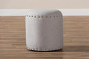 Augusta Light Gray Fabric Upholstered Nail Trim Ottoman Baxton
