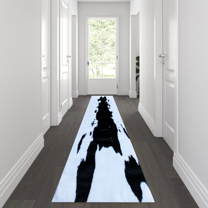 Naomi Collection 2' x 7' Black Faux Cowhide Print Area Rug with Polyester Backing iHome Studio